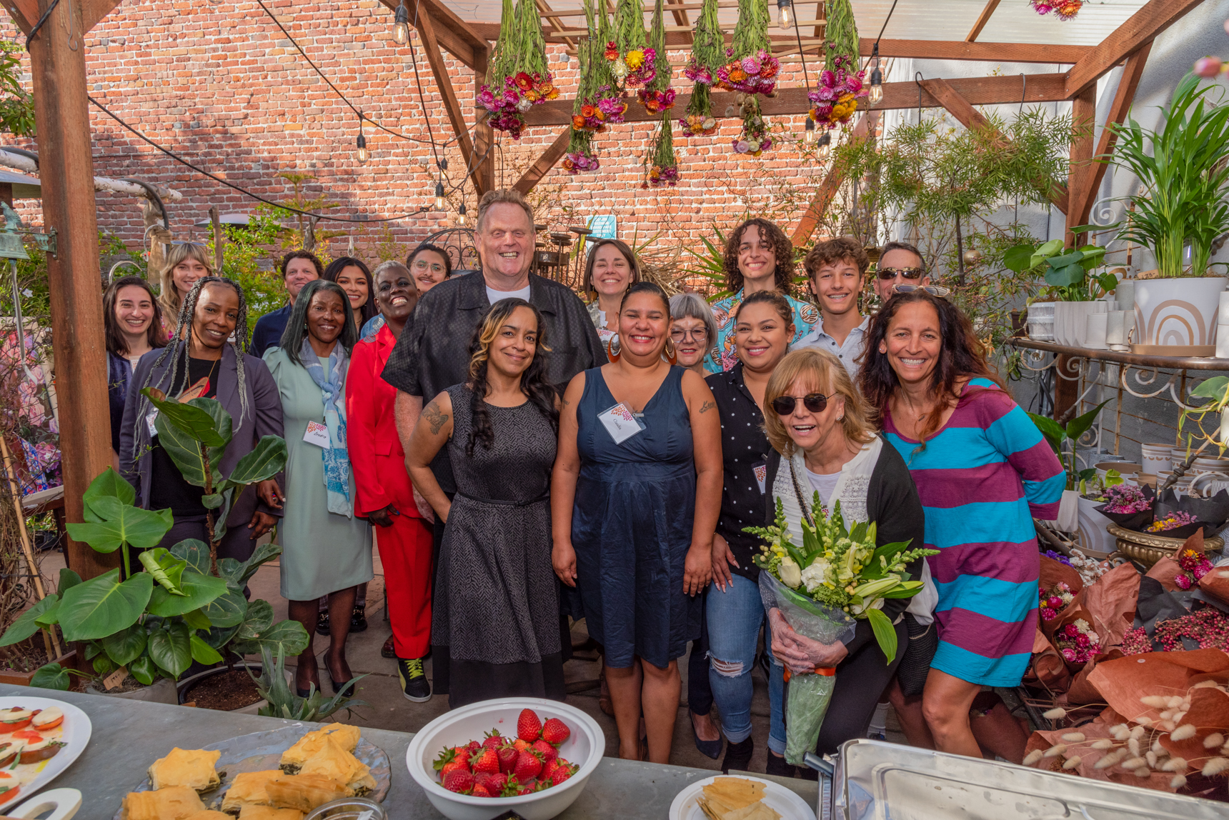 Group photo outdoors at Brothers & Sister Flowers
